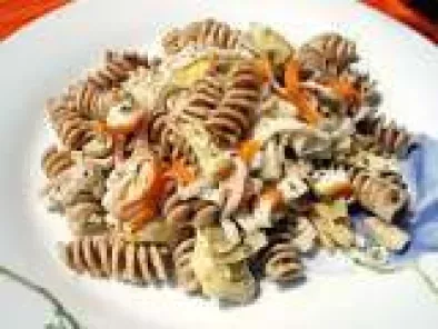 The art of Italian cooking: pasta salad with artichokes and surimi crab sticks