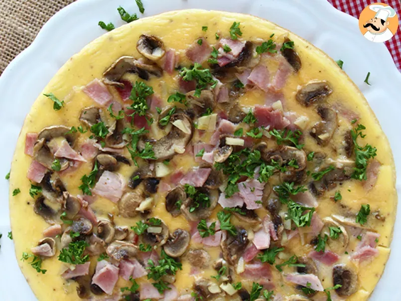 French omelette with mushrooms, ham and parsley - photo 2