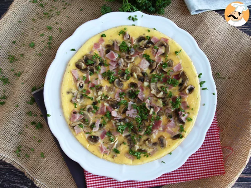 French omelette with mushrooms, ham and parsley - photo 3