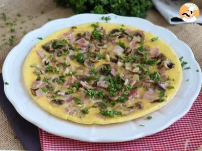 French omelette with mushrooms, ham and parsley