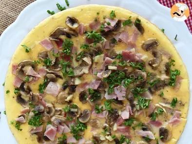 French omelette with mushrooms, ham and parsley - photo 2