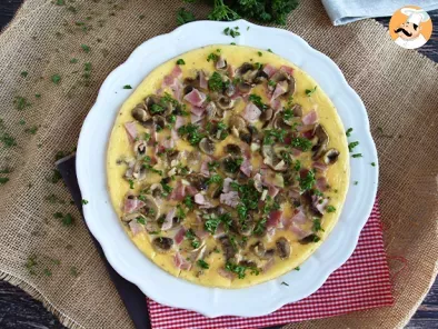 French omelette with mushrooms, ham and parsley - photo 3