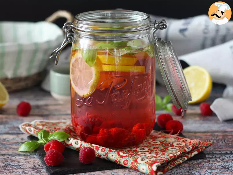 Homemade flavored water with lemon, basil and raspberry