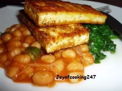 Marinated Tofu-paneer(Indian Cottage Cheese) on a bed of wilted spinach and baked beans