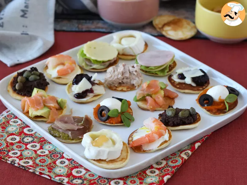 Platter of garnished blinis, the varied aperitif perfect for parties