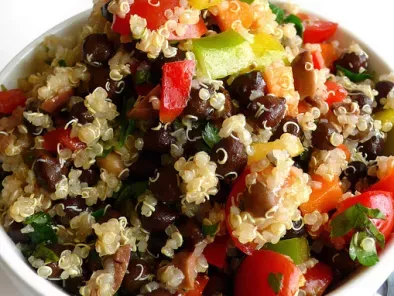 Quinoa and black chickpea salad with mixed vegetables and olives