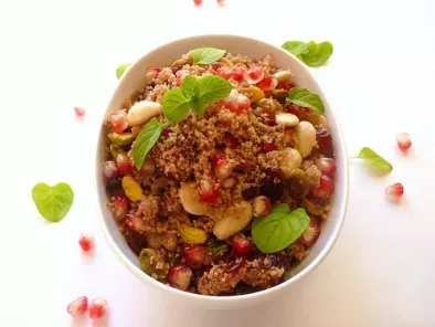 Spiced cous cous with dried fruits, pomegranate and mint