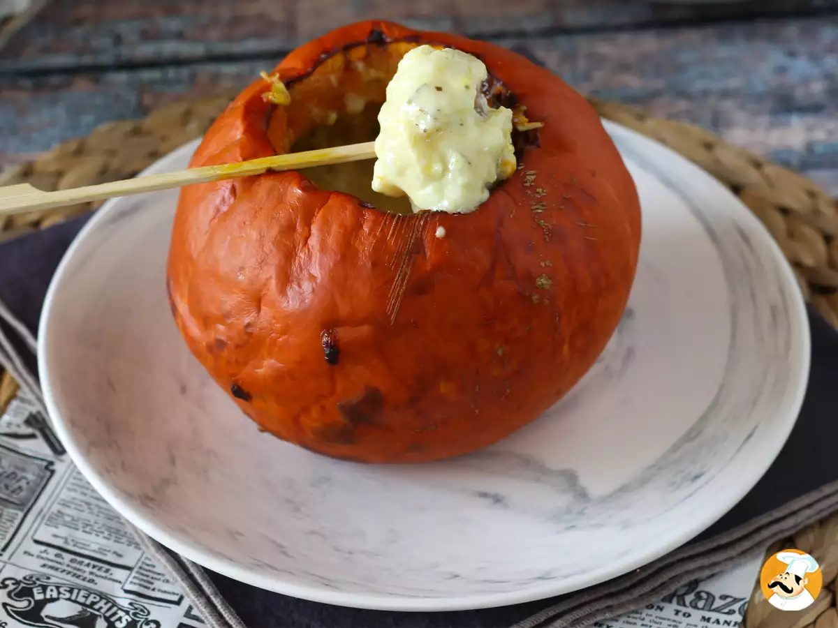 Need a Halloween sharing dish? This roasted pumpkin filled with melted cheese will steal the show