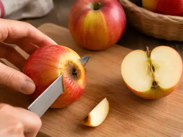 Can you safely eat fruit with mold after cutting away the spoiled part, or should you discard it?