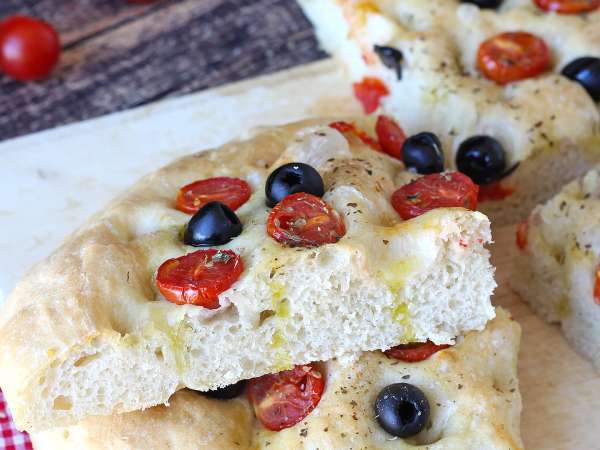 This must-try thick focaccia with cherry tomatoes and olives fills your home with a delicious aroma