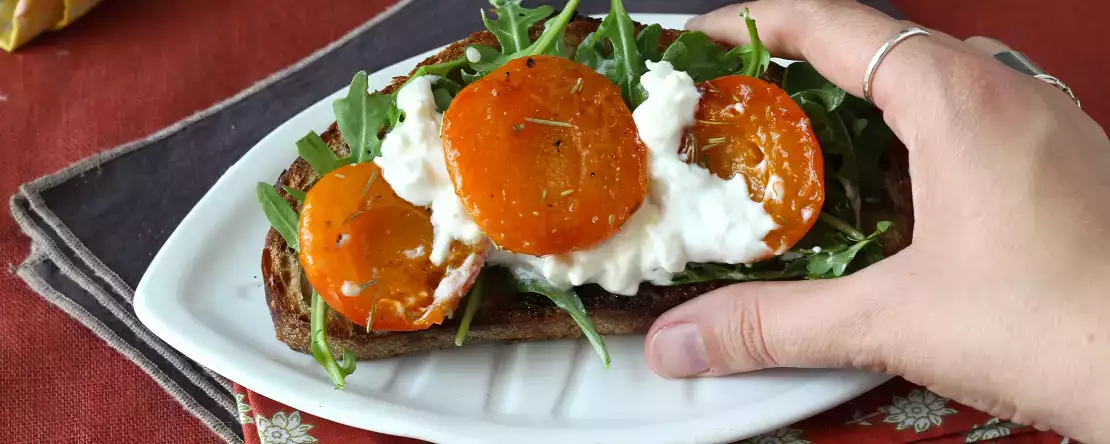 Roasted apricots, arugula and burrata on toast
