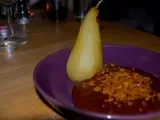 Recipe Poached pears in a chocolate and baileys custard with a flapjack crumble topping.