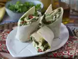 Recipe Mediterranean wrap stuffed with hummus, arugula, peppers and feta