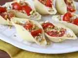 Recipe Chilled stuffed conchiglioni with stracciatella, pistachios, cherry tomatoes, and lemon