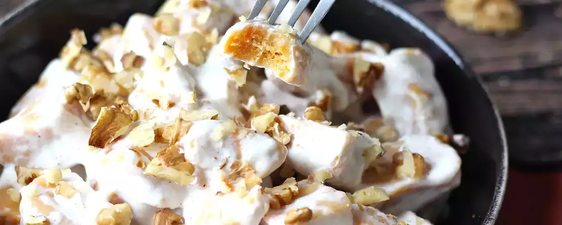 Creamy pumpkin gnocchi with cream cheese and crunchy walnuts