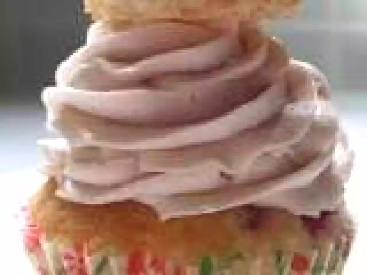 Coconut and raspberry cupcakes decorated with coconut macaroons
