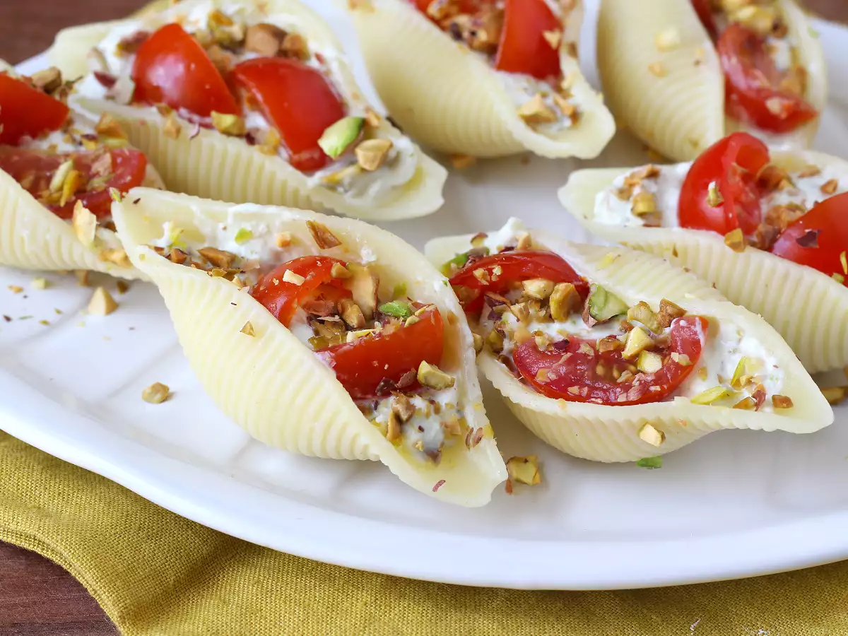 Recipe Chilled stuffed conchiglioni with stracciatella, pistachios, cherry tomatoes, and lemon