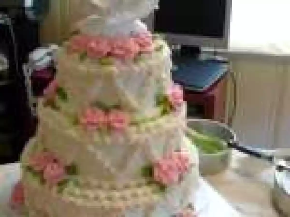 3 tiered chocolate cake with chocolate mousse filling and buttercream frosting.