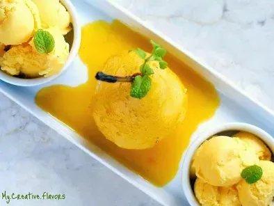 Recipe Classy poached pear in spicy mango nectar with mango ice cream