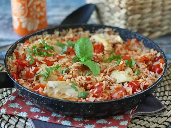 Recipe One-pot chicken dish with rice, tomatoes, and bell peppers