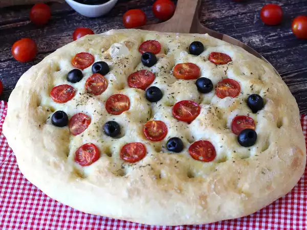 Recipe Thick, fluffy focaccia with cherry tomatoes, olives, and oregano