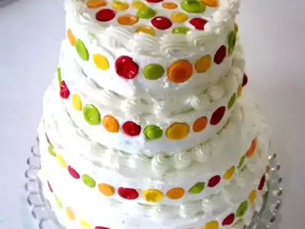 Recipe Almond cake with raspberry filling, almond buttercream, and candy buttons!