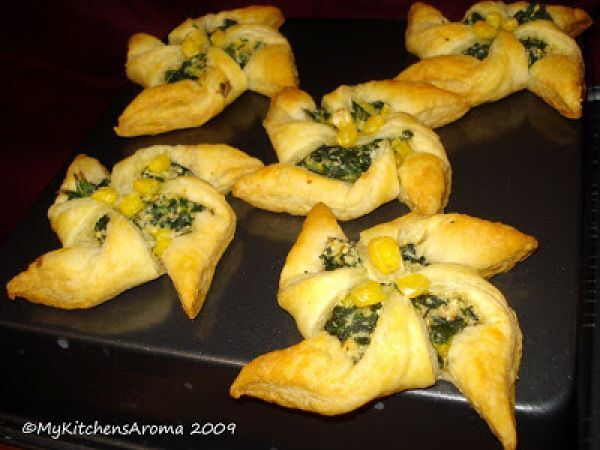 Recipe appetizers - puff pastry 'pinwheels' with spinach-corn-ricotta cheese filling
