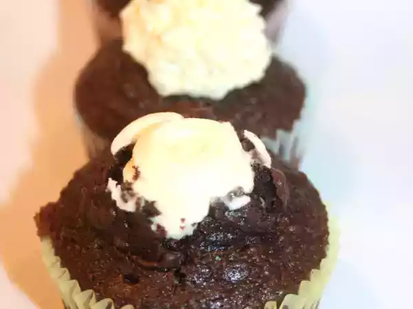 Recipe Chocolate cupcakes with volcano style orange icing