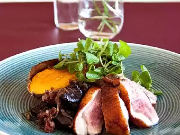Recipe Duck breasts with dry-roasted sweet potatoes, watercress & balsamic prunes & onions
