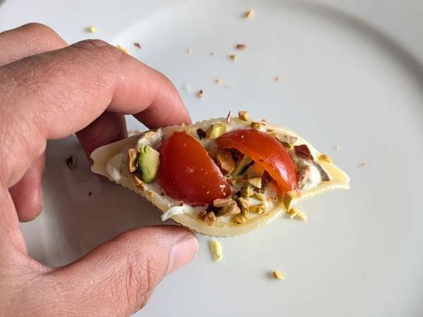 Chilled stuffed conchiglioni with stracciatella, pistachios, cherry tomatoes, and lemon - Preparation step 8