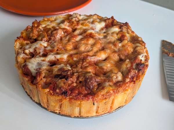 Baked rigatoni cake with sausage, béchamel sauce, and mozzarella - Preparation step 14