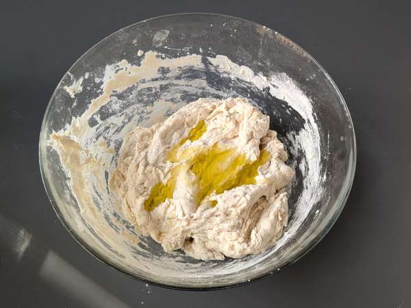 Thick, fluffy focaccia with cherry tomatoes, olives, and oregano - Preparation step 3