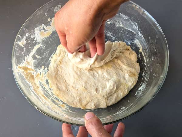 Thick, fluffy focaccia with cherry tomatoes, olives, and oregano - Preparation step 5