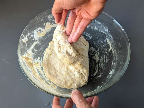Thick, fluffy focaccia with cherry tomatoes, olives, and oregano - Preparation step 6