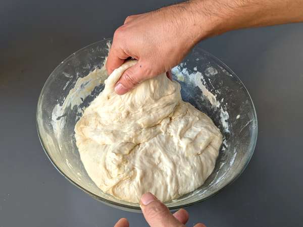 Thick, fluffy focaccia with cherry tomatoes, olives, and oregano - Preparation step 7