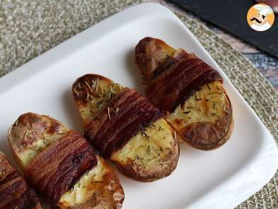 Baked potatoes coated with bacon