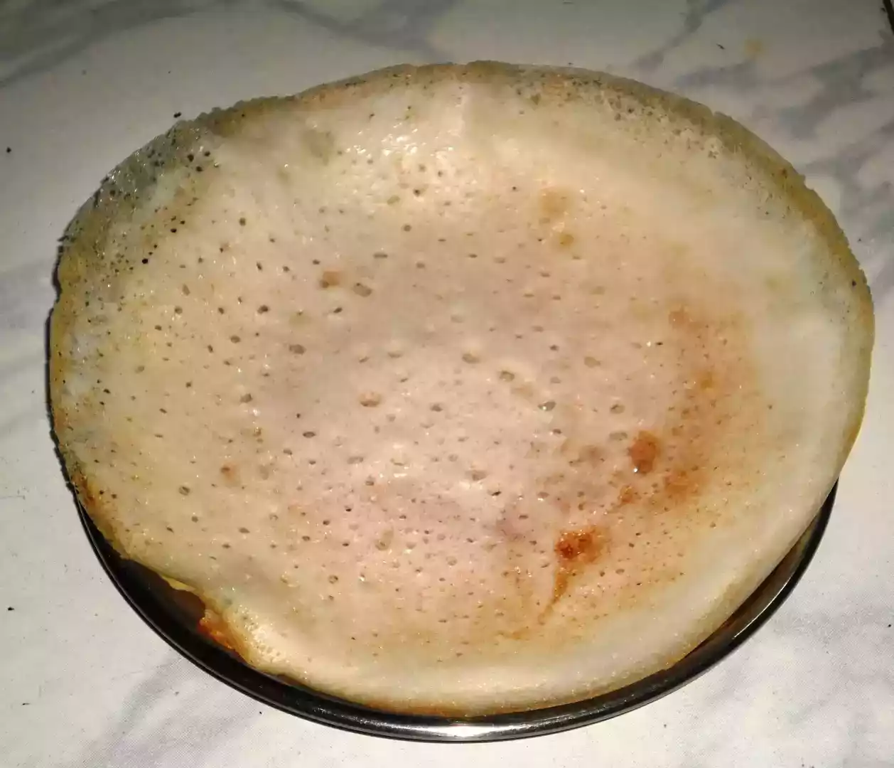Coconut appam (indian pancake with coconut milk) for breakfast