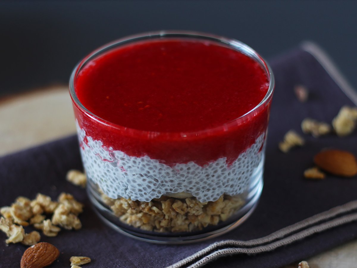 Coconut milk chia pudding verrine with granola and raspberry - photo 3