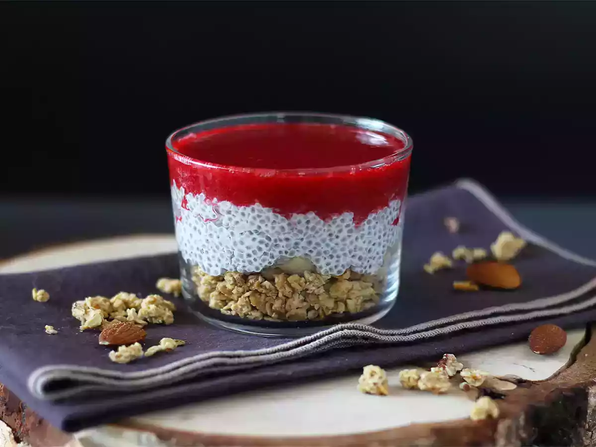 Coconut milk chia pudding verrines with granola and raspberries
