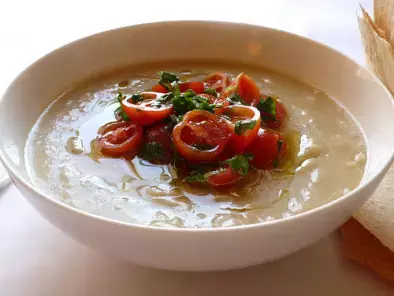 Cold puree of fava bean soup with cherry tomato and basil relish