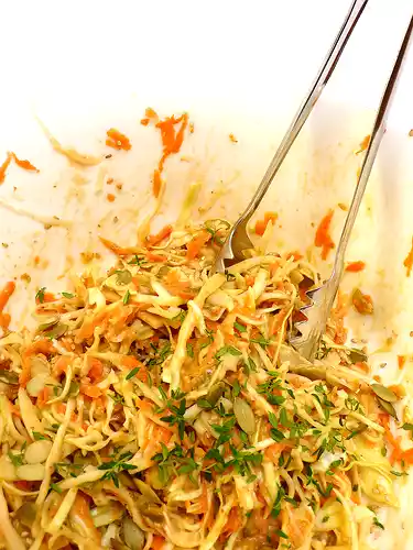 Creamy cabbage and carrot salad recipe with pumpkin seeds