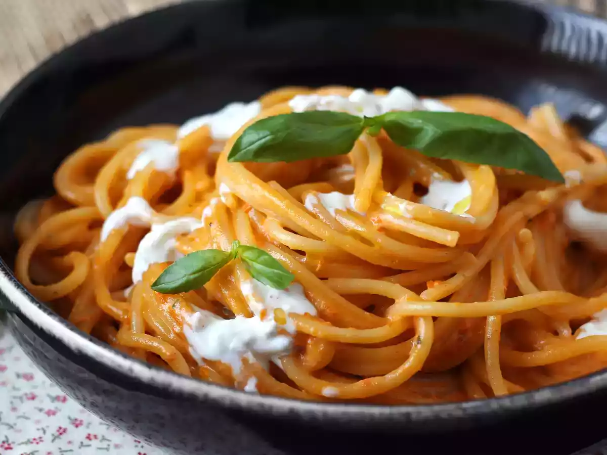 Creamy pasta with burrata cheese and cherry tomatoes