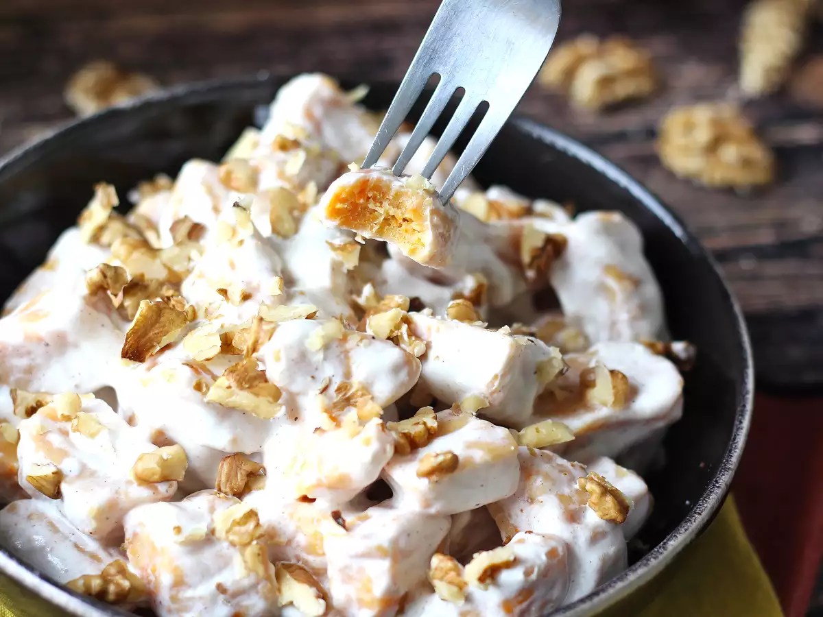 Creamy pumpkin gnocchi with cream cheese and crunchy walnuts