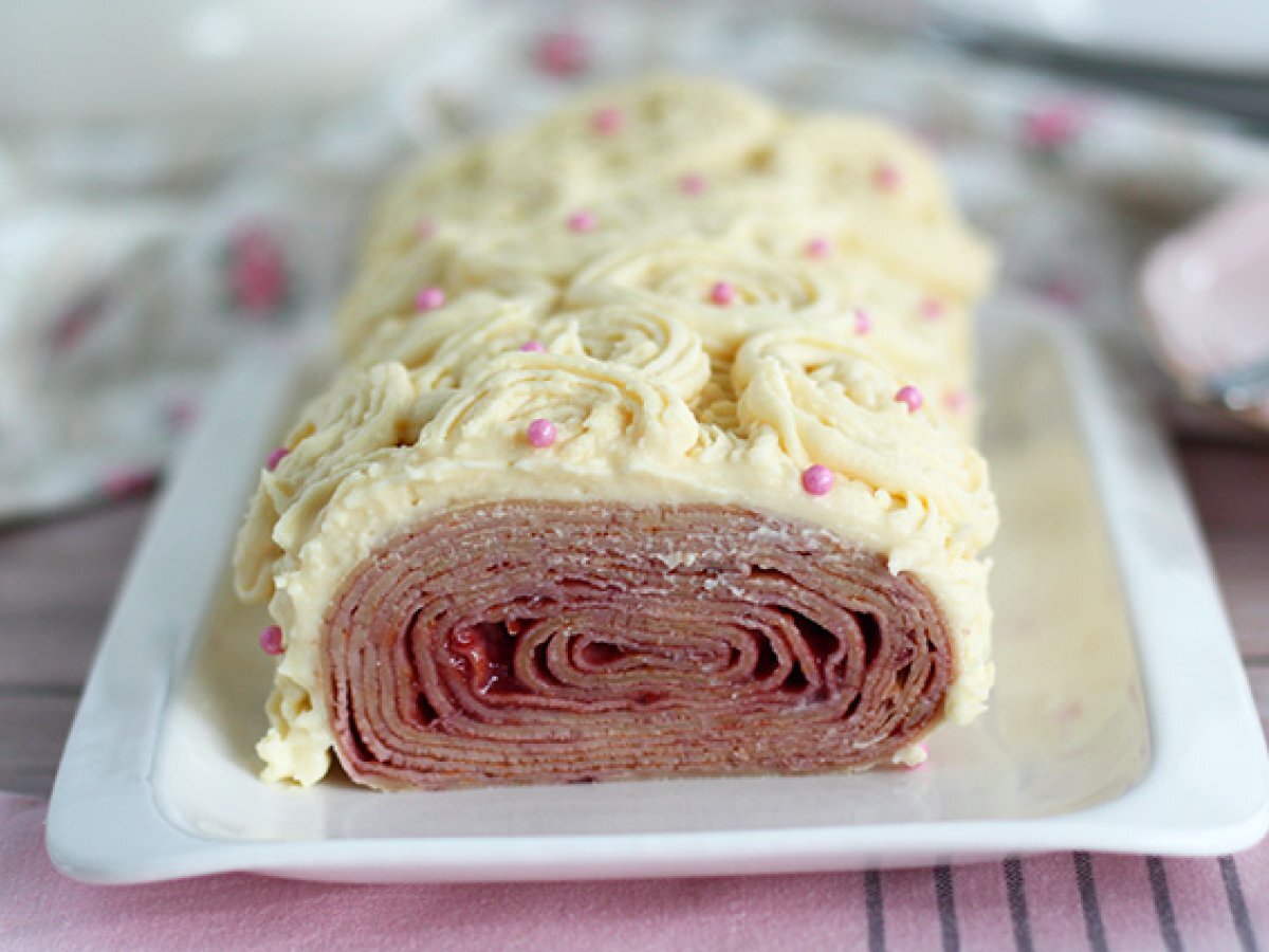 Crepe yule log with raspberry and white chocolate