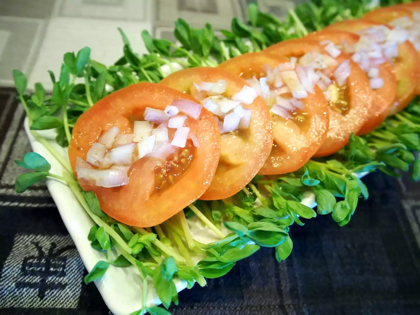 Crunchy tomato salad with pea sprouts