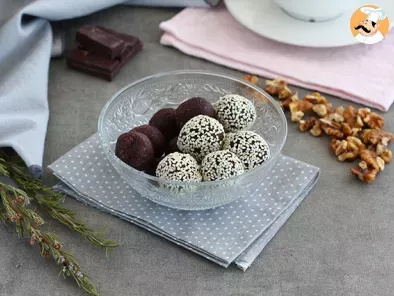 Dates and chocolate energy balls with sesame seeds