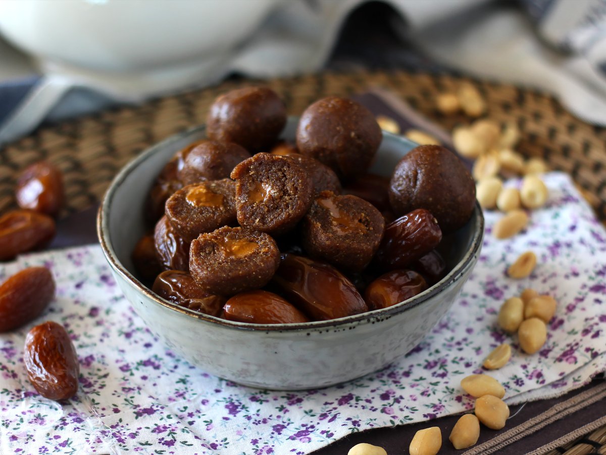 Energy balls with dates and a melting peanut butter heart