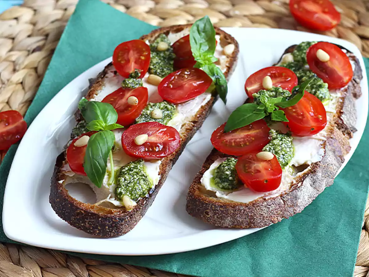 Fresh cheese, pesto, and cherry tomato toasts