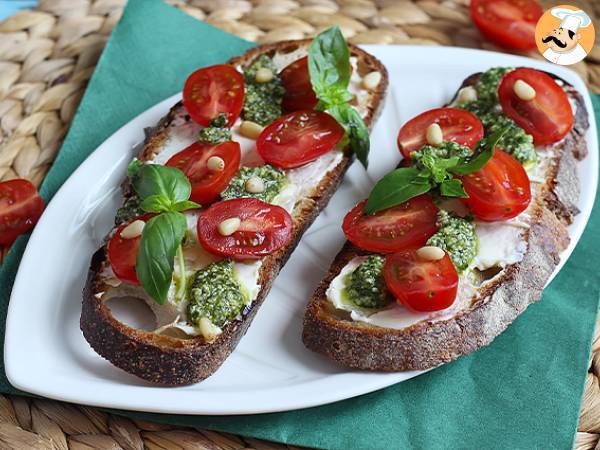 Fresh cheese, pesto, and cherry tomato toasts