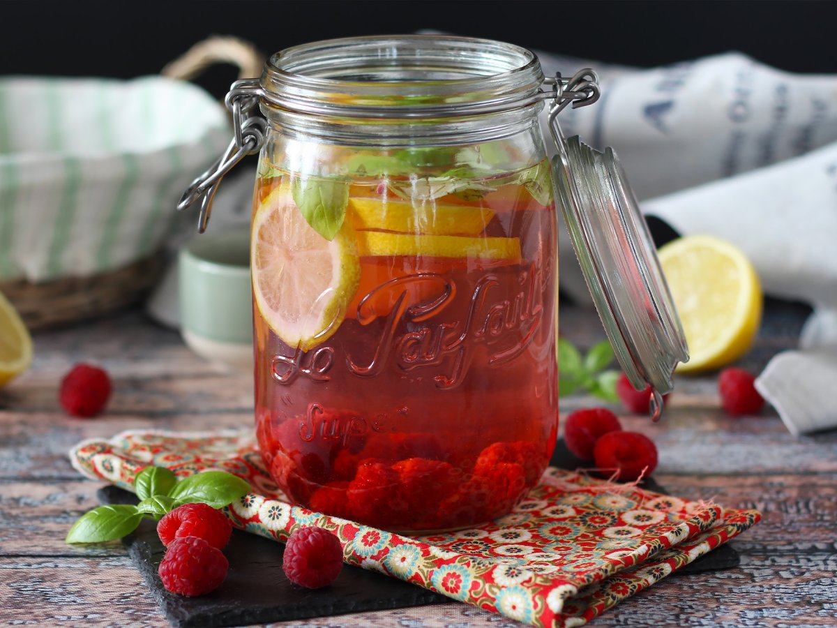 Homemade flavored water with lemon, basil and raspberry